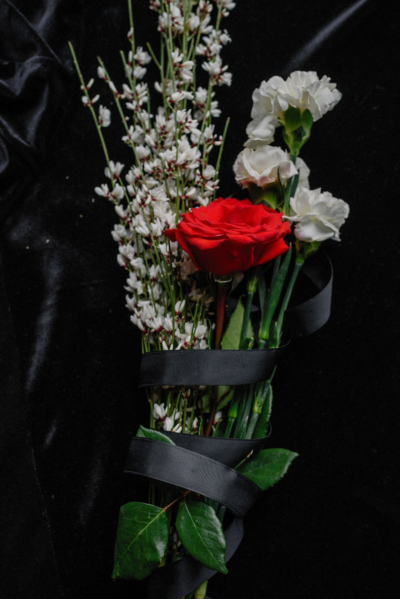 Photo by Ksenia Chernaya A Flower Bouquet Wrapped in Black Ribbon